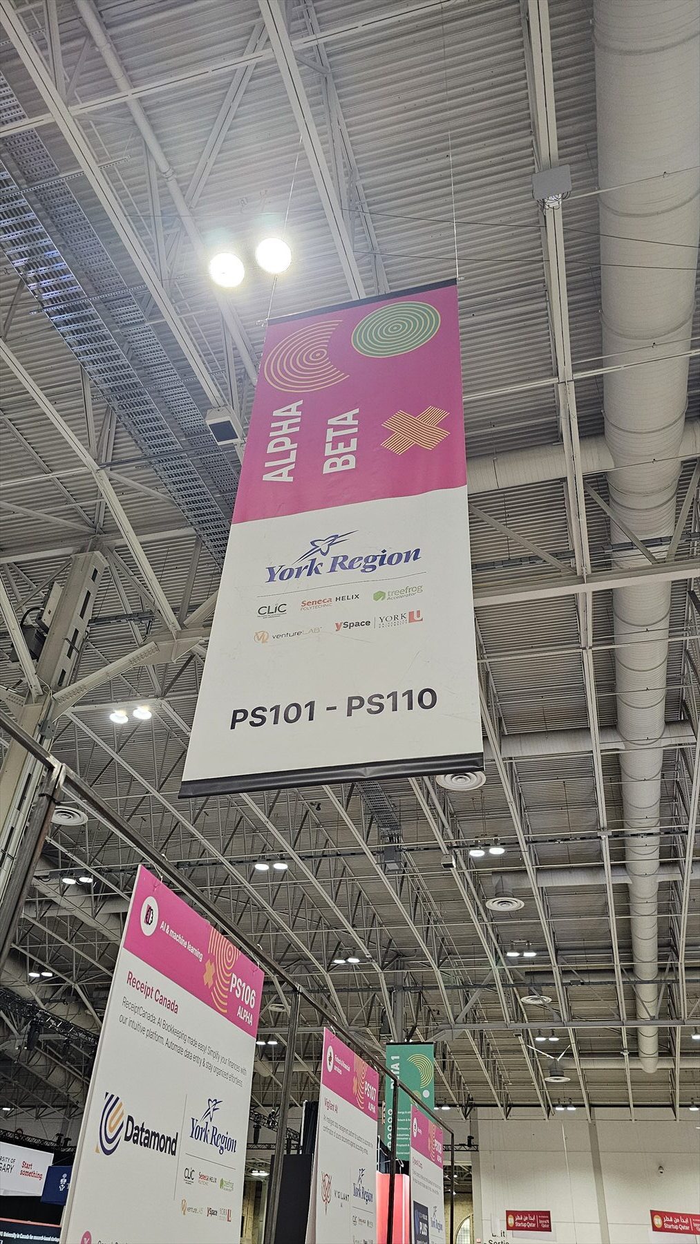 We-Watch booth signage on the Collision 2024 conference floor in Toronto